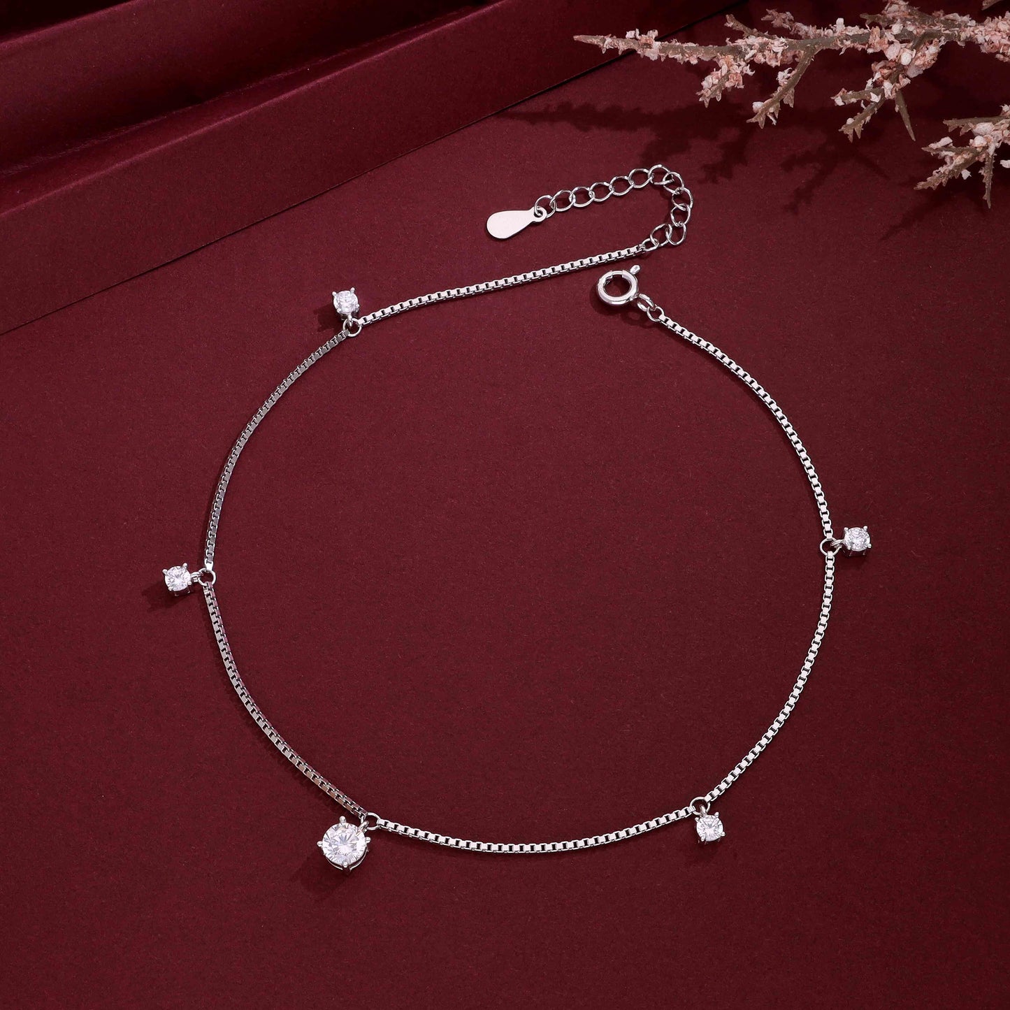 Silver charm anklet with sparkling stone accents