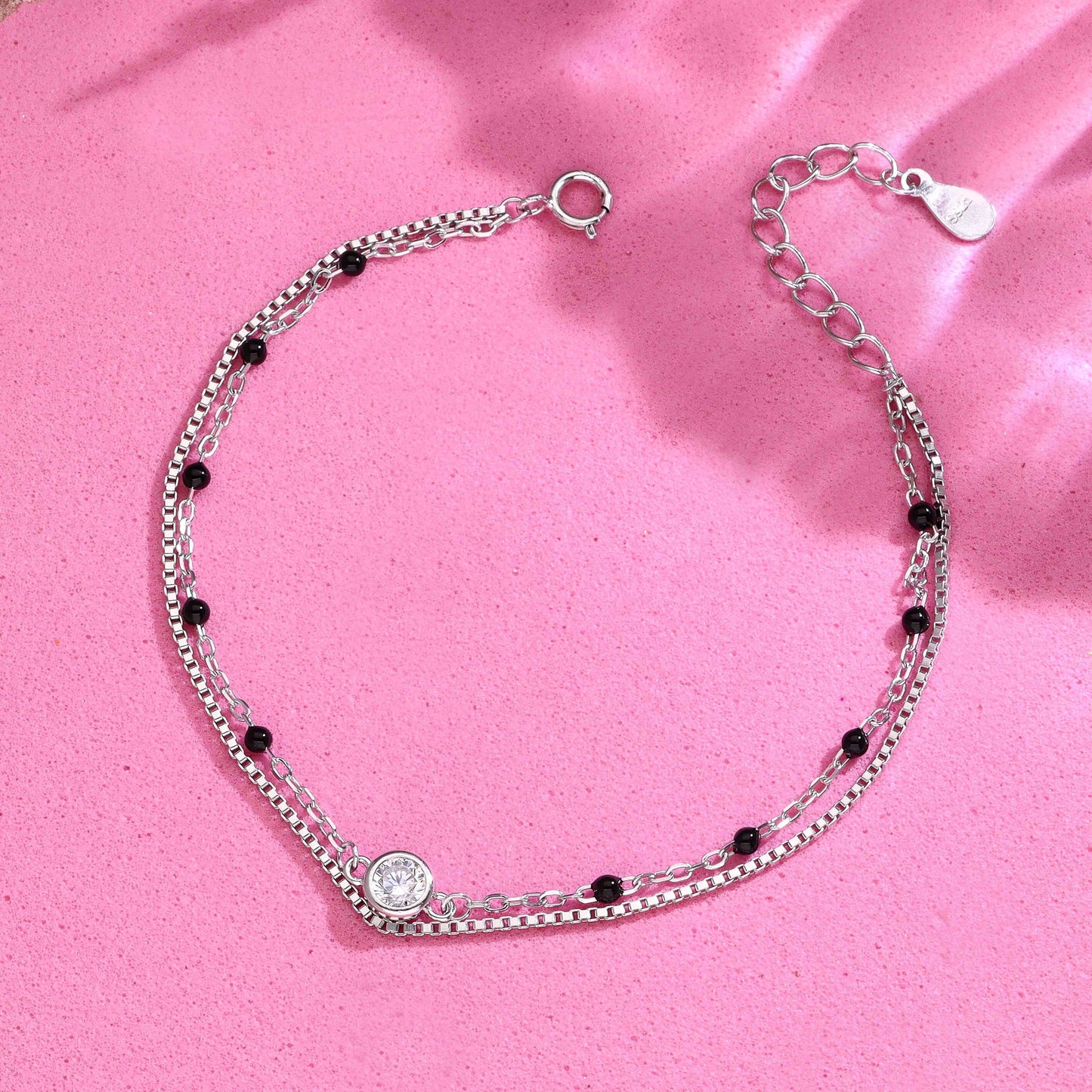 Sterling silver double chain bracelet with black beads