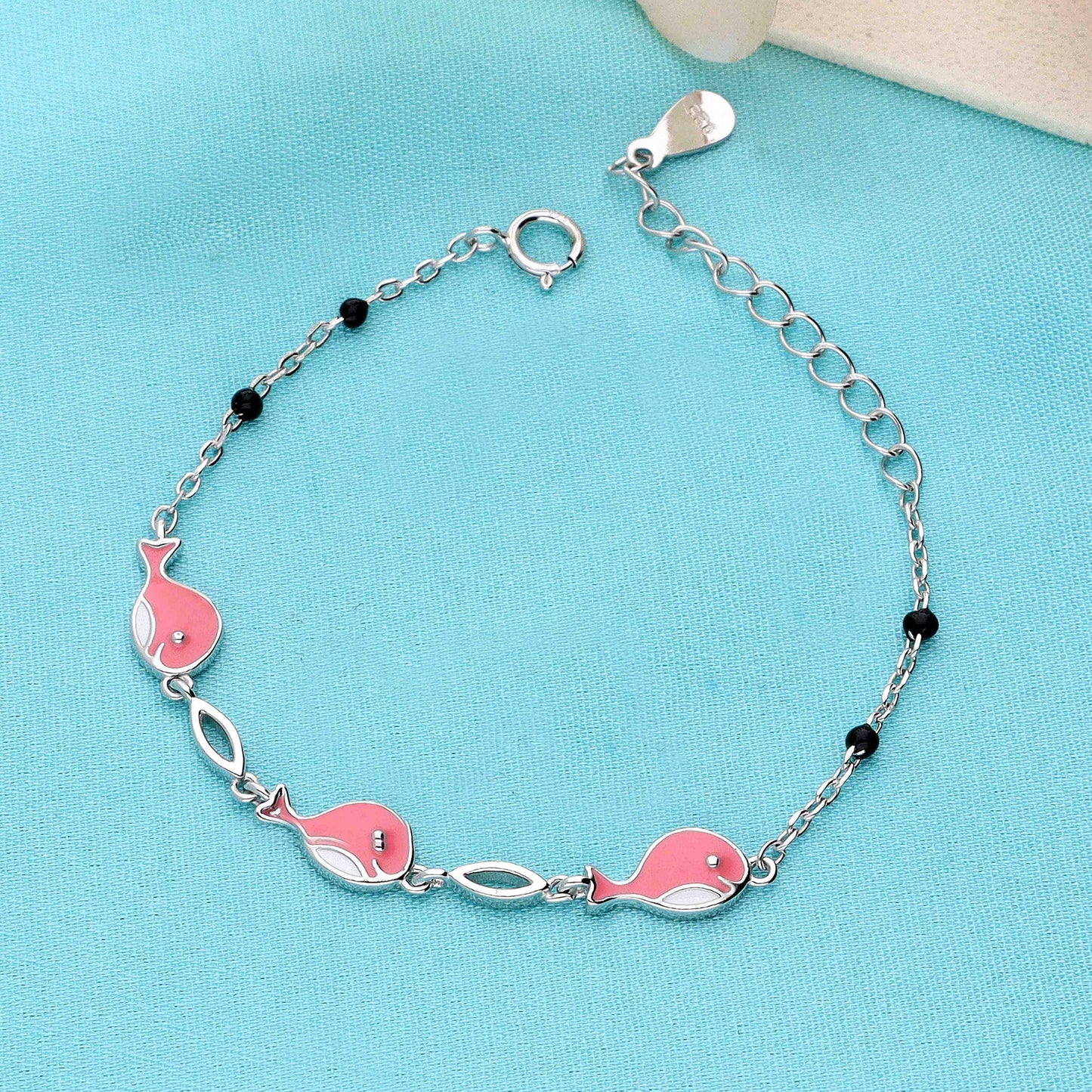 Sterling silver bracelet for girls with pink fish charms and black bead accents