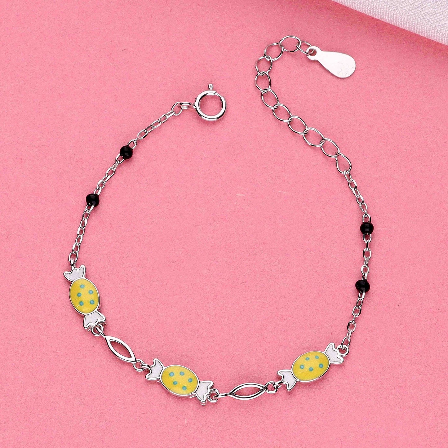 Sterling silver bracelet for girls with yellow candy-shaped charms and black beads