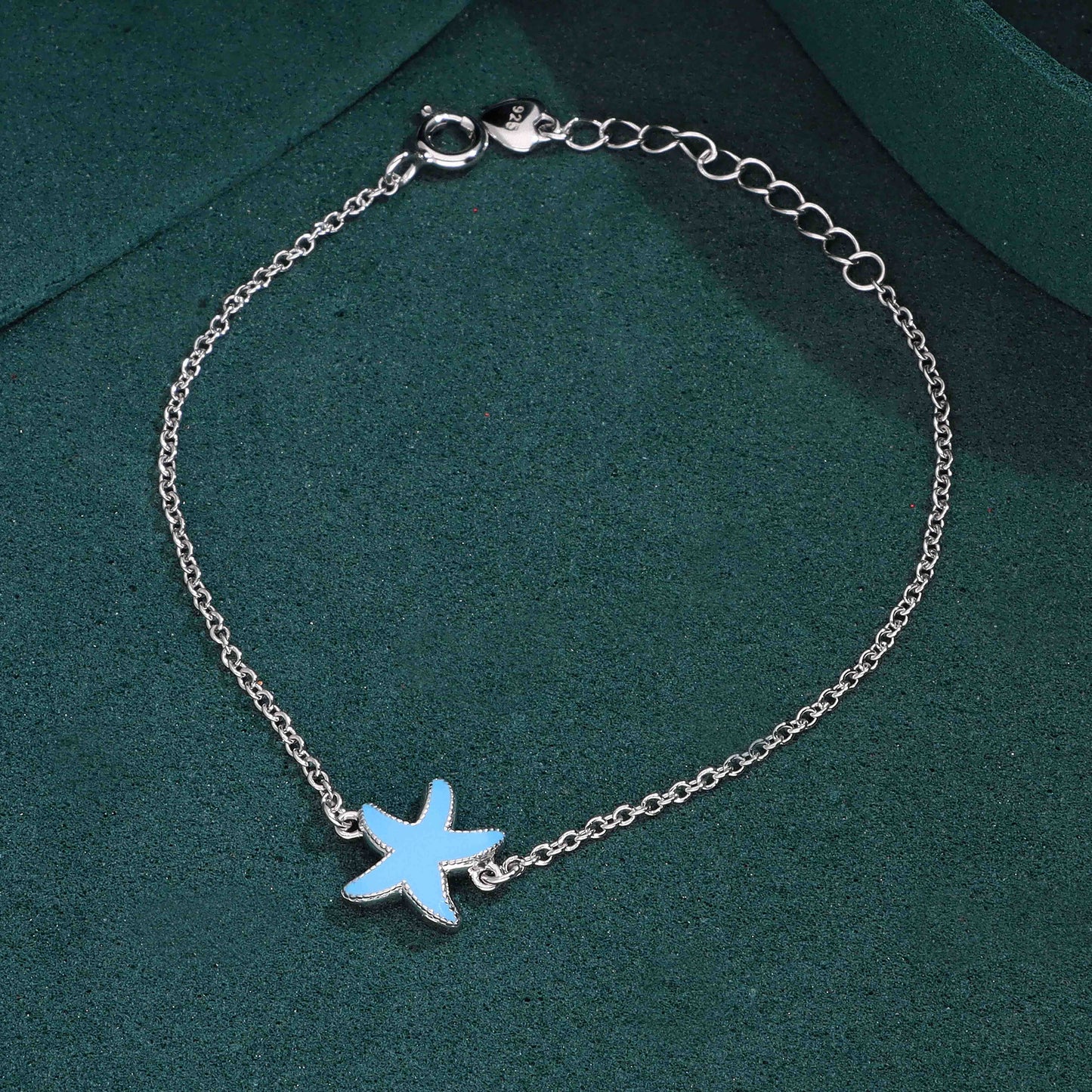 Silver bracelet with blue enamel starfish charm
