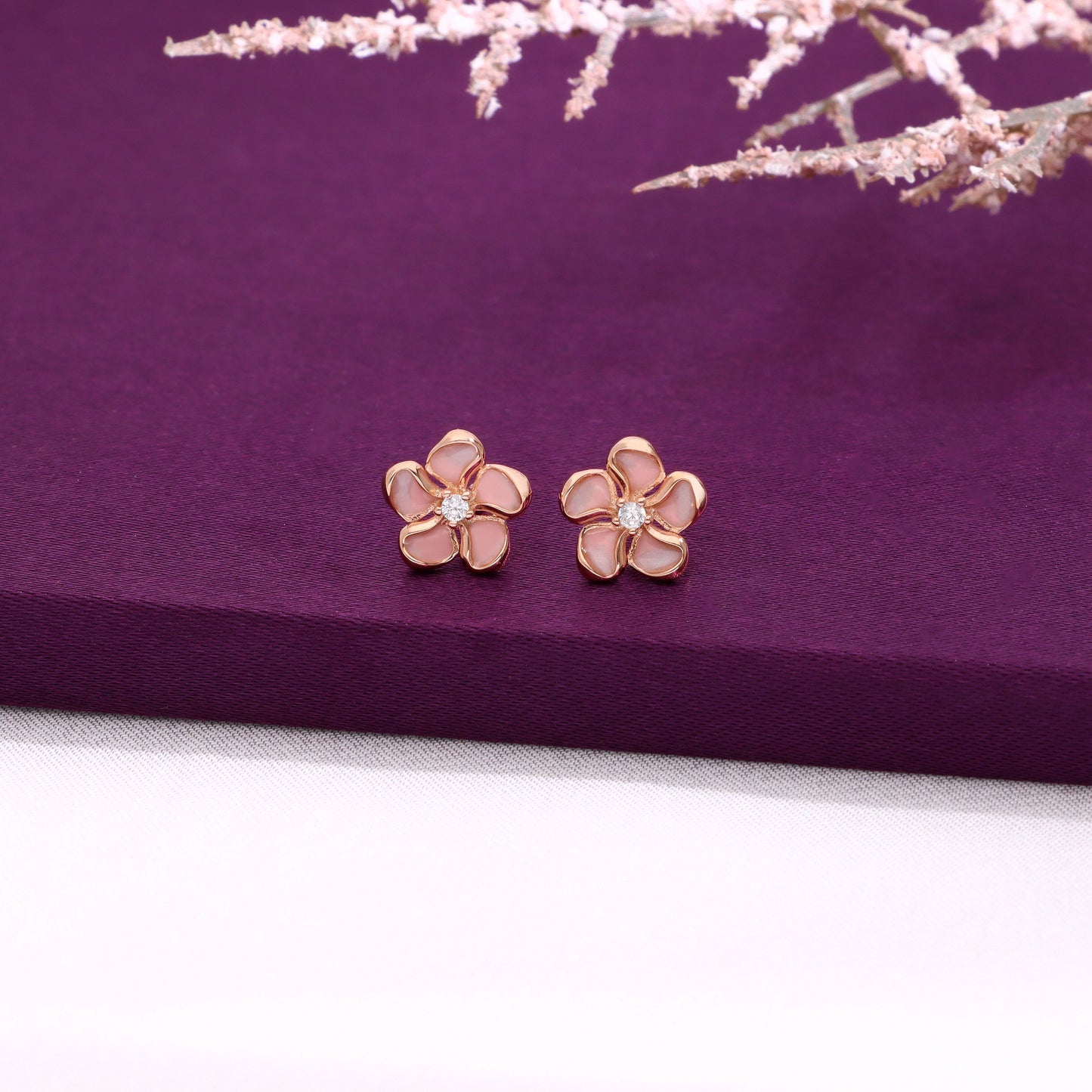 Dainty silver flower stud earrings with pink enamel petals and crystal center 