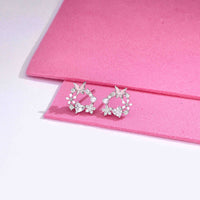 Sterling silver butterfly and floral wreath stud earrings with cubic zirconia and pearl accent