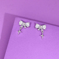 Dainty bow and star drop earrings in 925 sterling silver with heart-cut
