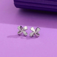 Silver bow-shaped earrings with sparkling crystals