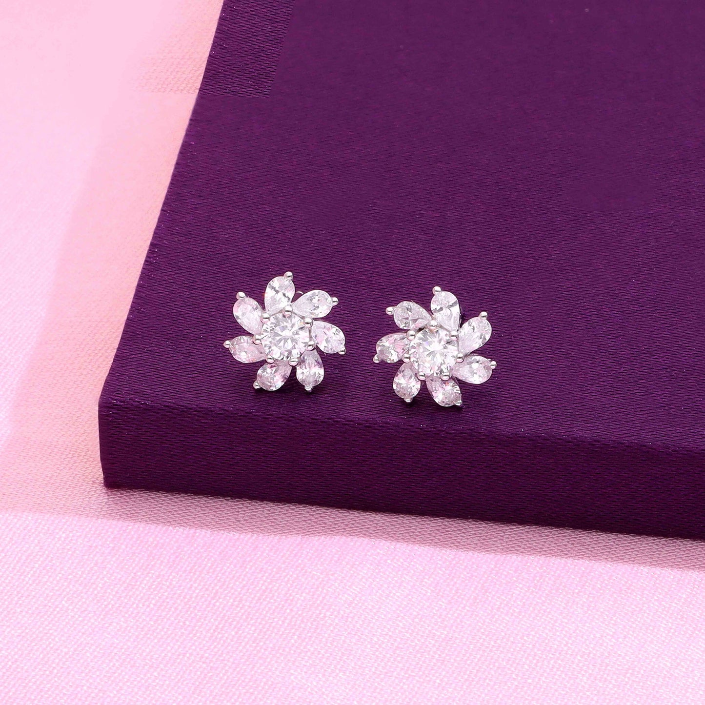 Floral marquise diamond stud earrings with round center stones