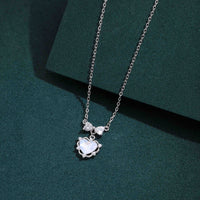Sterling silver heart pendant necklace with cubic zirconia accents on chain
