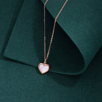 Rose gold heart pendant necklace with mother of pearl on sterling silver chain