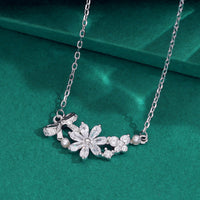 Elegant silver floral crystal pendant necklace with pearl accents