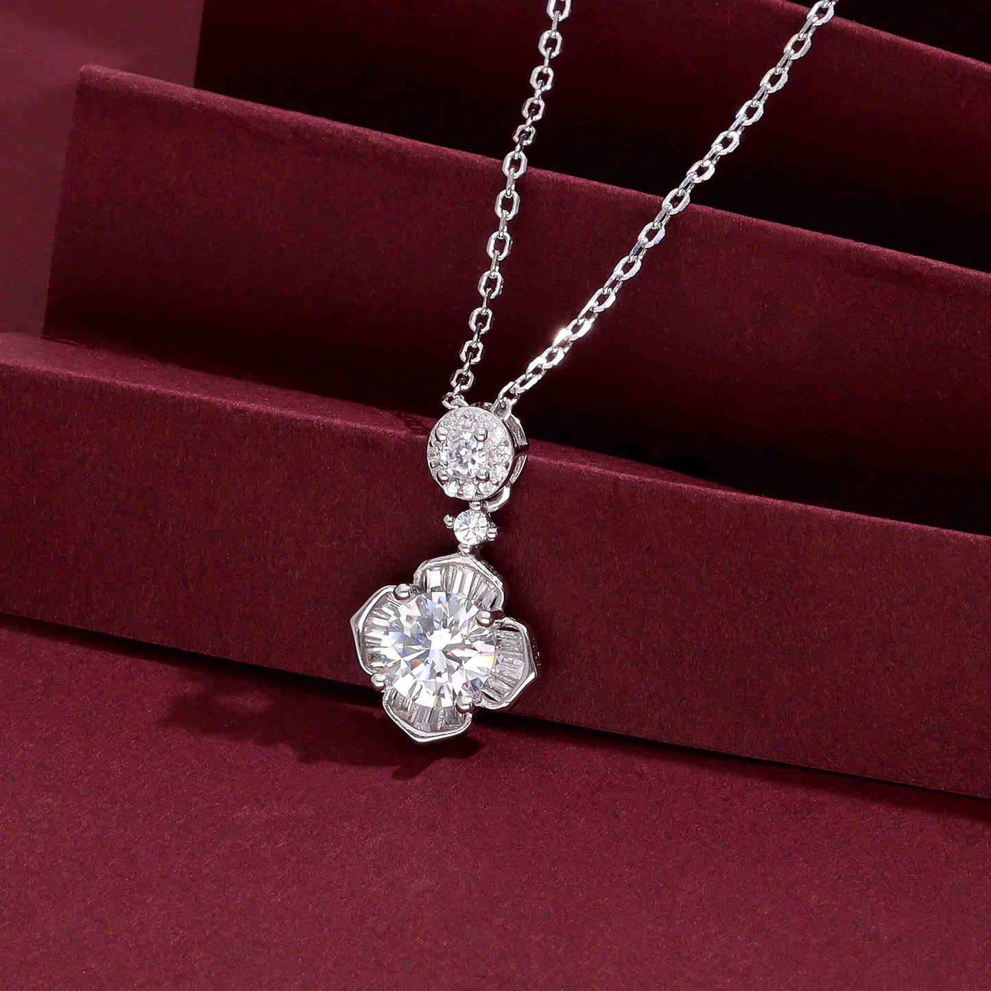 Elegant floral crystal necklace with a round-cut center stone and baguette-cut crystals