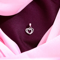 Sterling silver double heart pendant with cubic zirconia accents