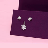 Sterling silver snowflake pendant and matching stud earrings set with cubic zirconia design
