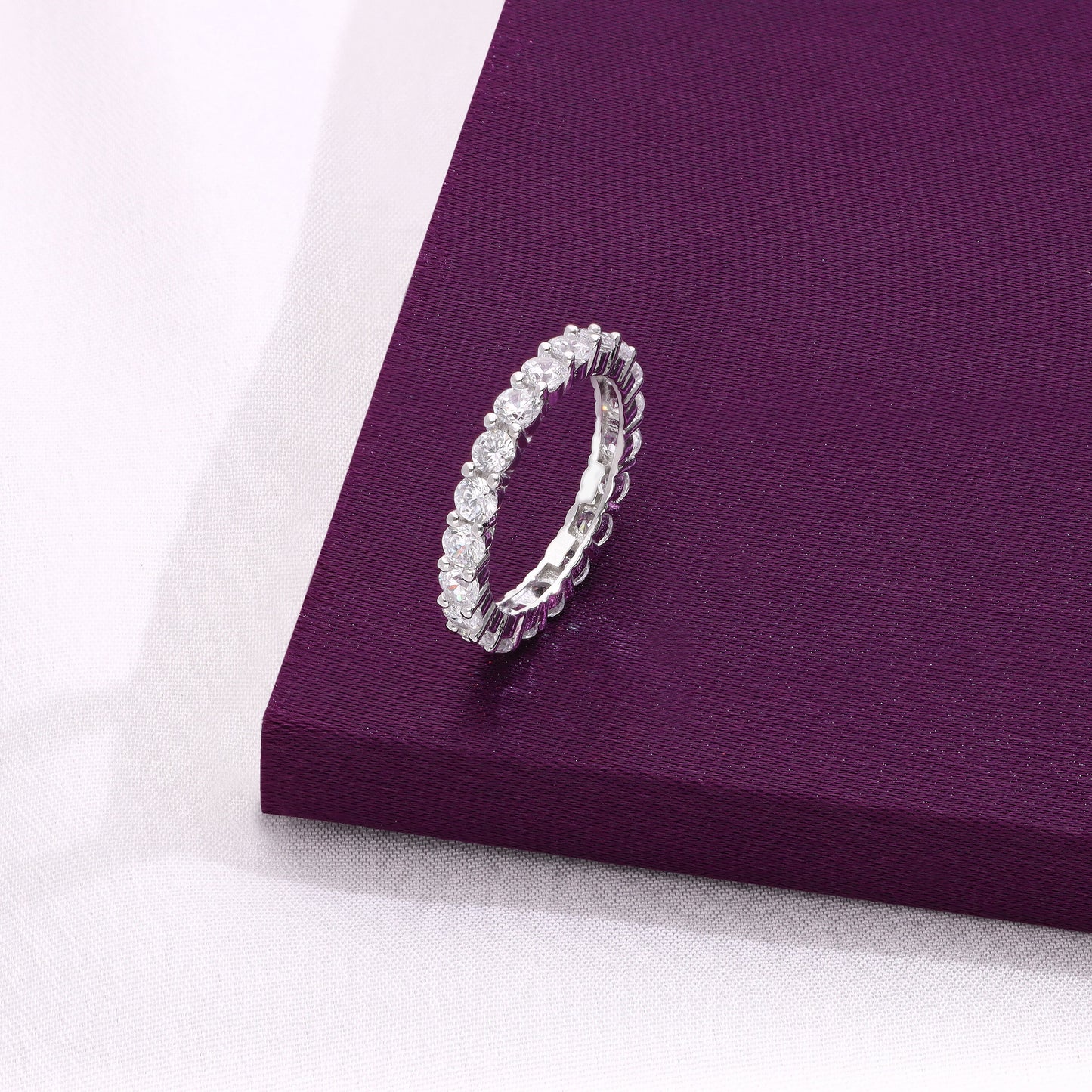 full eternity band with round-cut diamonds, displayed