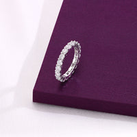 full eternity band with round-cut diamonds, displayed