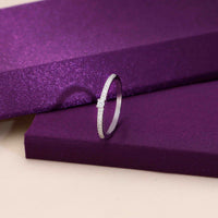 Silver ring with diamond accents, featuring a delicate design