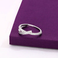 Sterling silver crossover ring with baguette and round