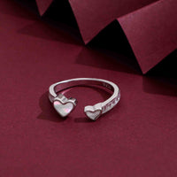 Sterling silver open ring with two heart designs, one featuring a Mother of Pearl inlay and the other polished silver