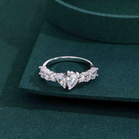 ring with twin pear-cut diamonds and round brilliant side stones in a half eternity setting