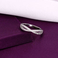 Sterling silver criss-cross ring with pavé cubic zirconia stones